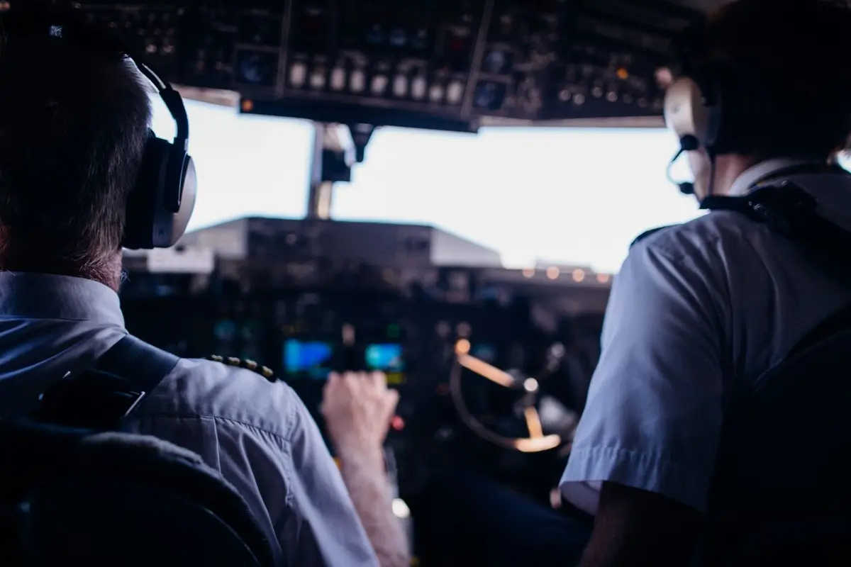 two pilots at the controls in an airplane cockpit, funny pilot jokes