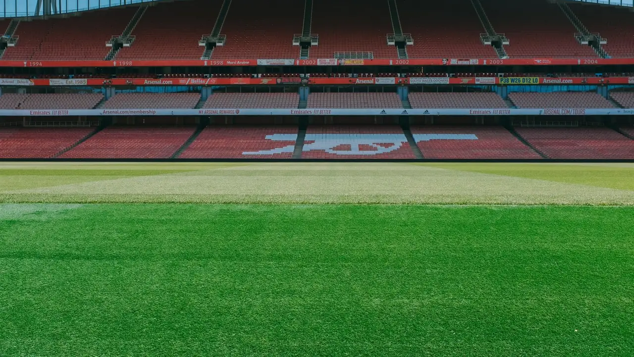a football pitch at ground level with a white goal line, image for arsenal cup night jokes