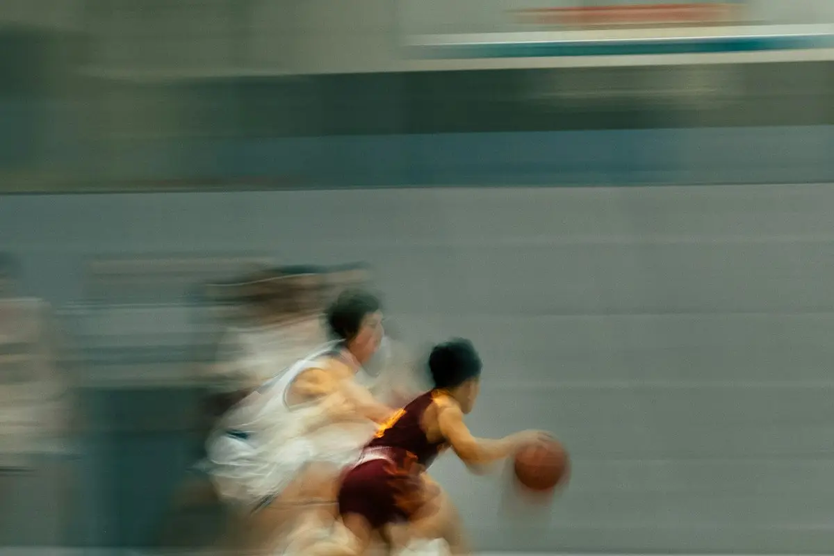 two players on a fast break in motion blur, scene for short basketball puns