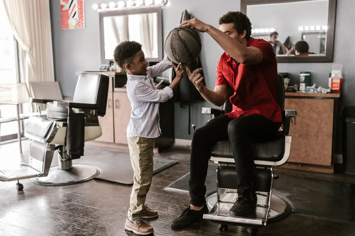 father and young son tossing a basketball between them, corny basketball dad jokes