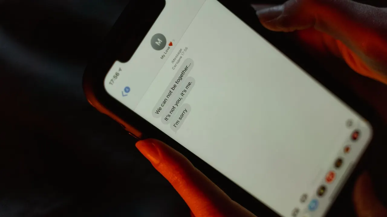 person texting on a smartphone, image for sorry i missed your birthday texts