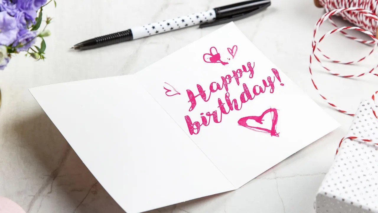 handwritten happy birthday card with pink hearts, image for cute birthday card puns