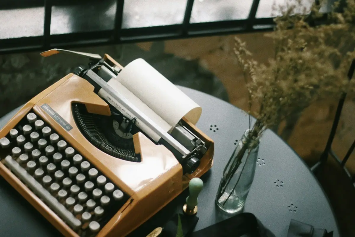 vintage typewriter on a desk, image for author and writing puns about drafts and writer's block