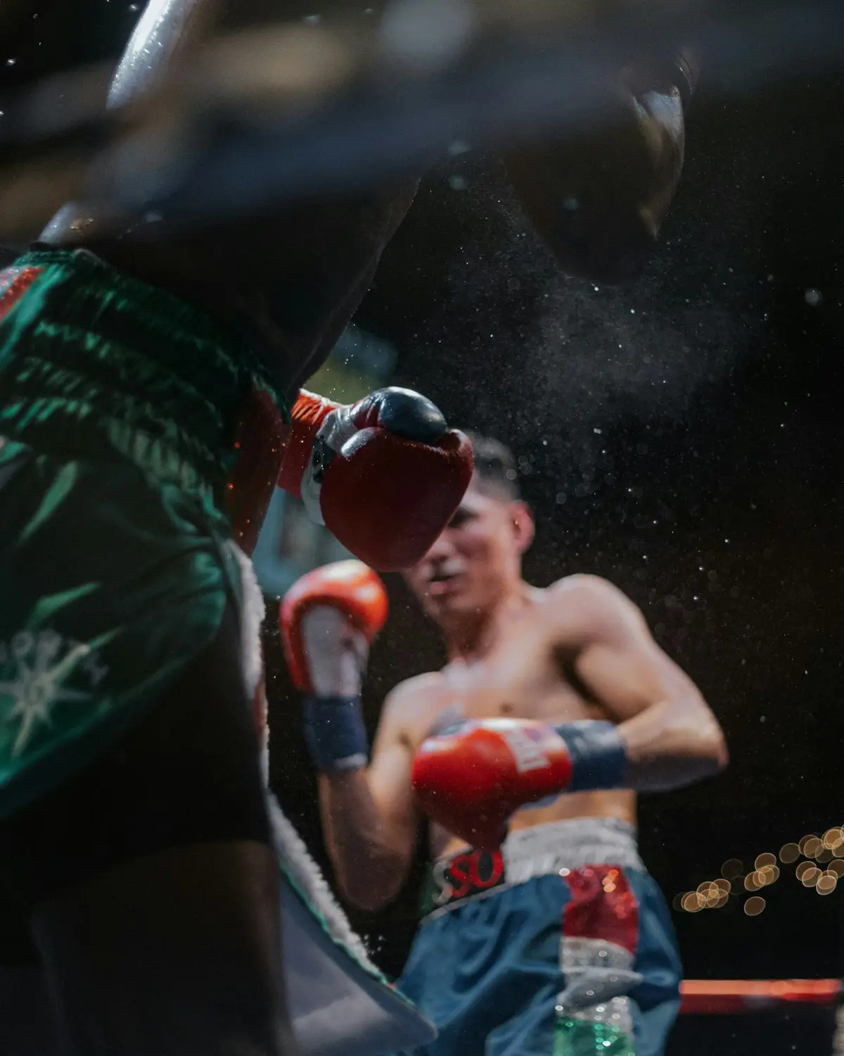 two boxers facing off inside a boxing ring, scene for boxing puns captions for instagram