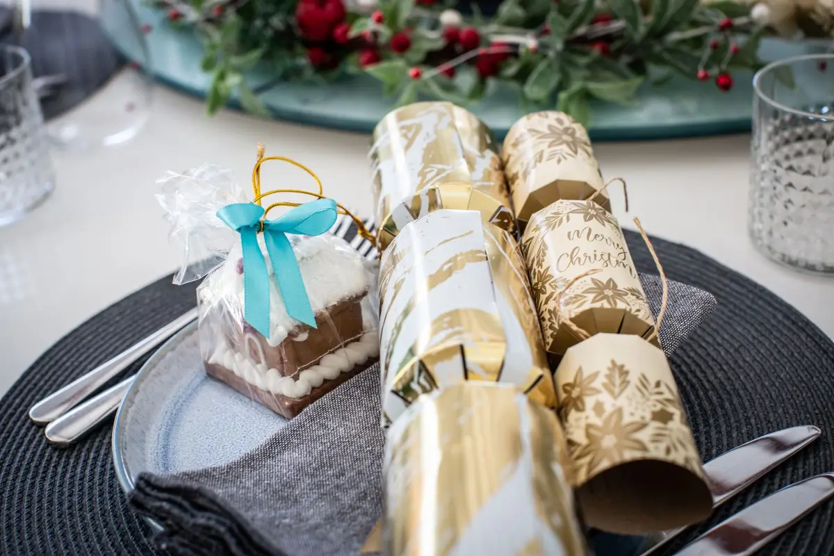 Christmas table set with festive crackers, christmas cracker jokes