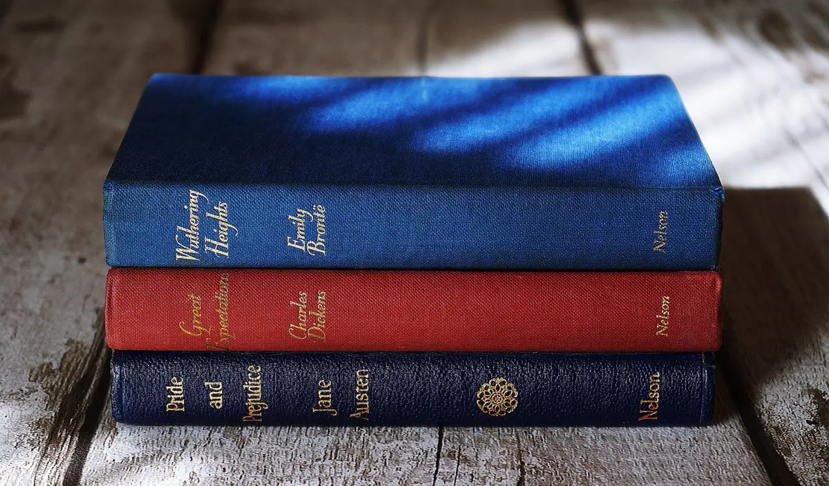 stack of classic novels including a Charles Dickens book, A Christmas Carol puns about Scrooge and Marley