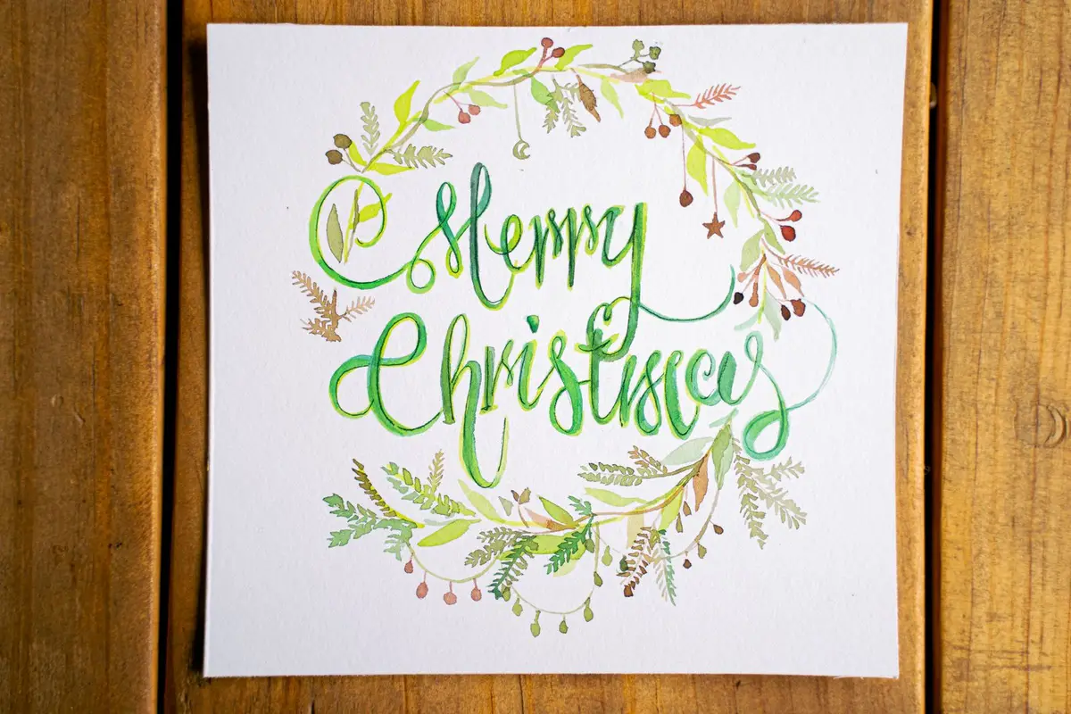 handmade Merry Christmas card with calligraphy, christmas card puns