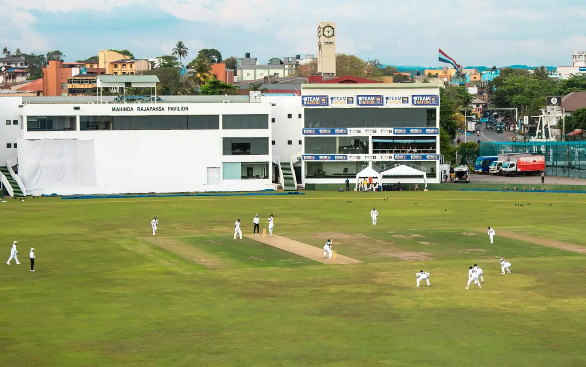 cricket match in progress on a green field, setting for cricket puns team names