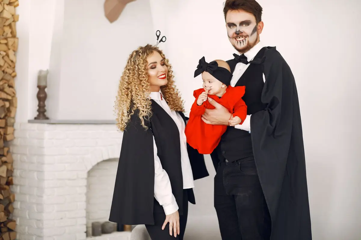 family in matching vampire costumes celebrating Halloween, vampire jokes