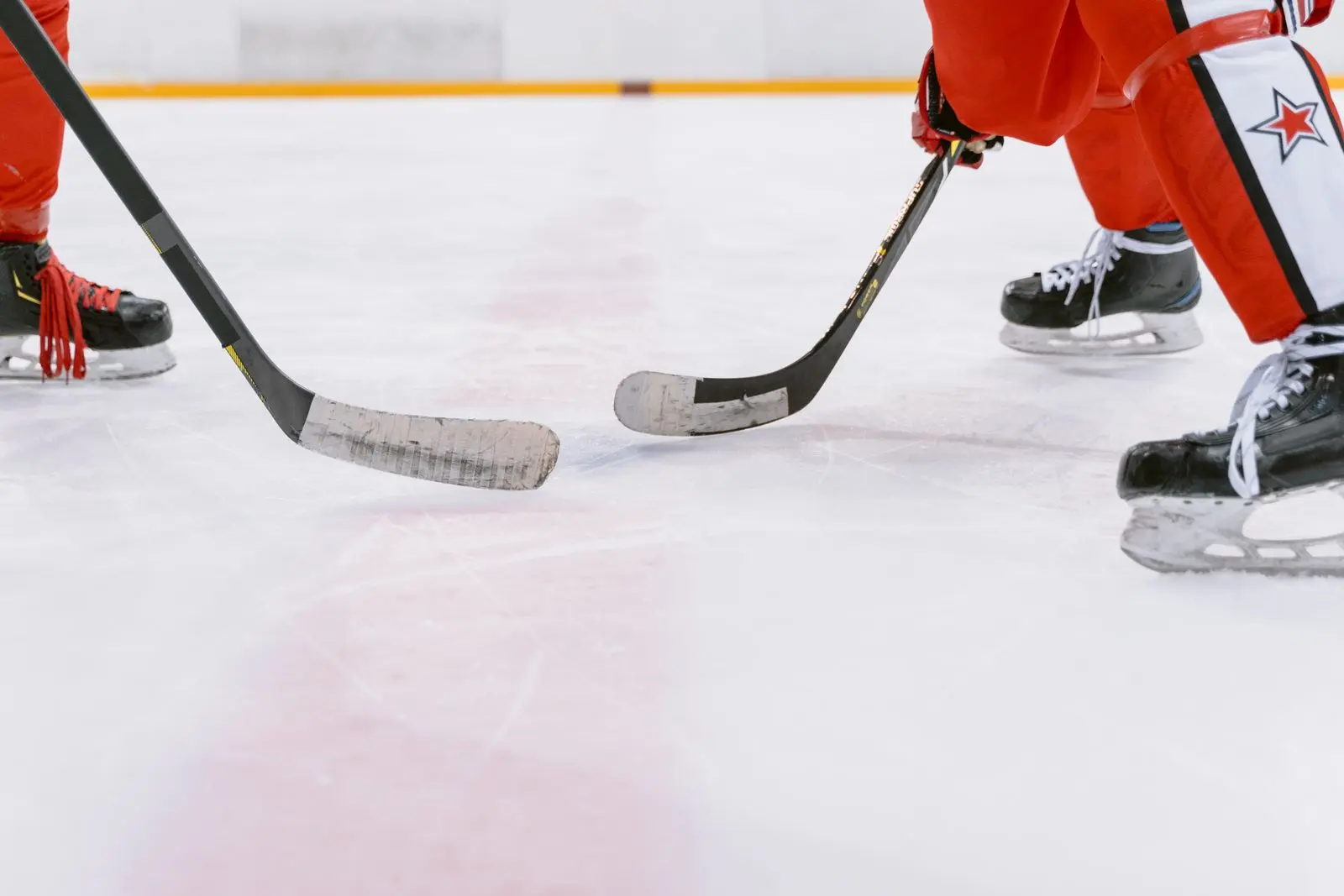 ice sport athletes competing on an indoor rink, image for curling captions for Instagram