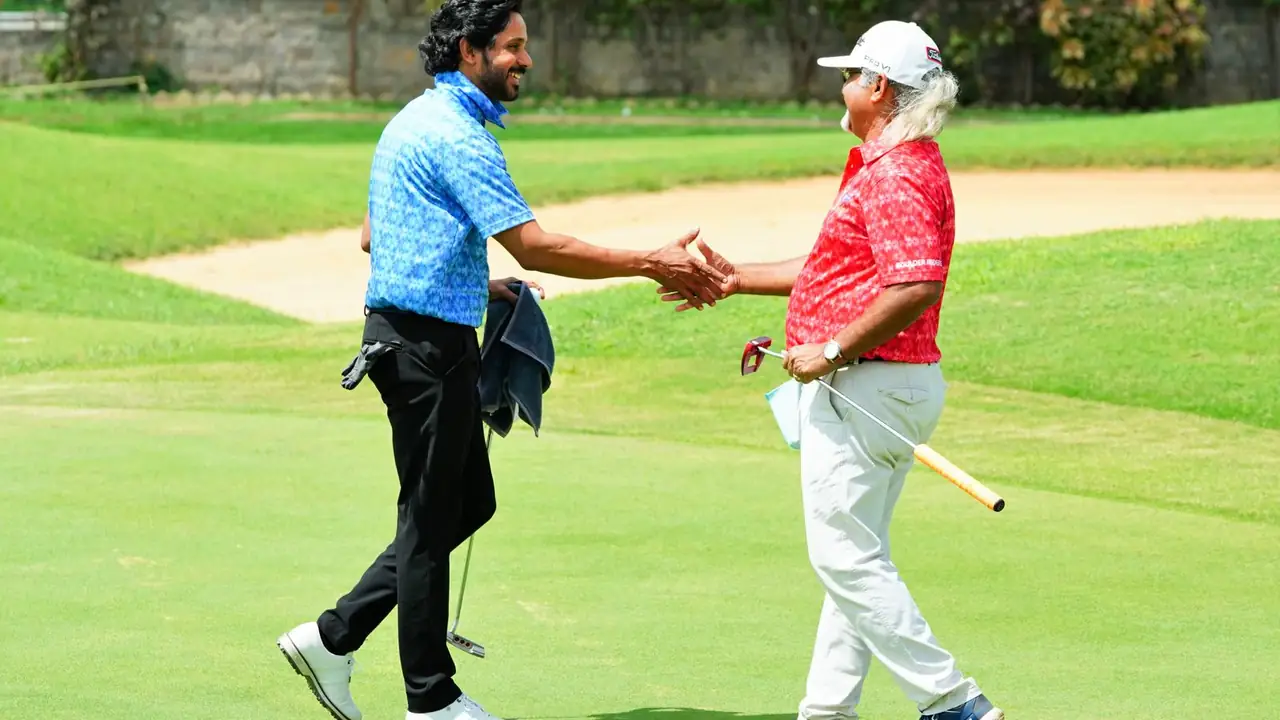 two golfers shaking hands on a golf course after a friendly round, image for golf buddy trip jokes