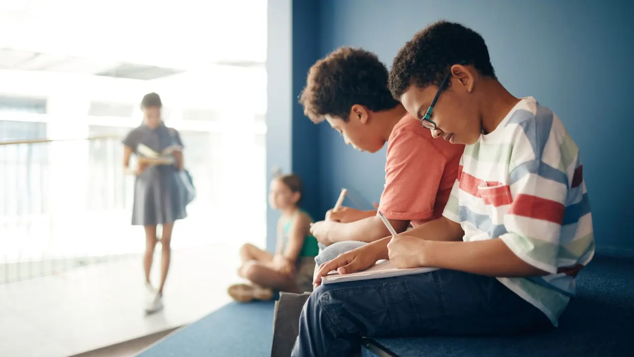 students studying together in a school hallway, image for grammar jokes for kids