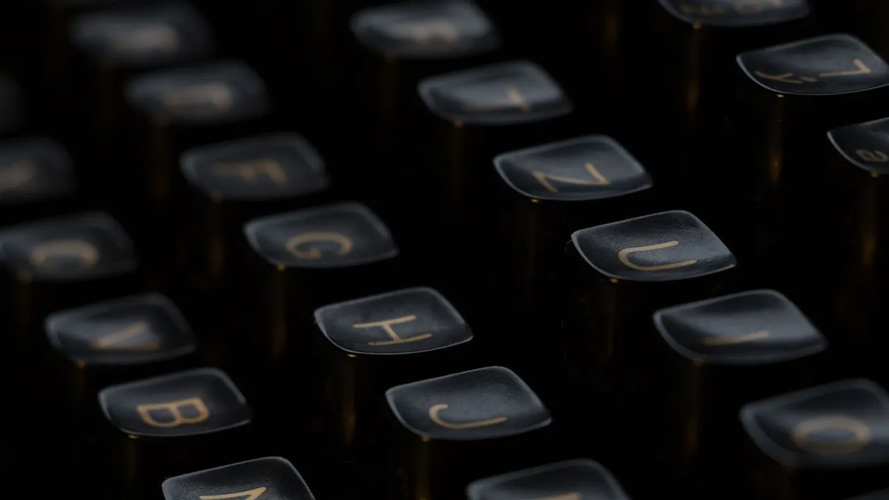 a close-up of vintage typewriter keys, image for homophone grammar jokes