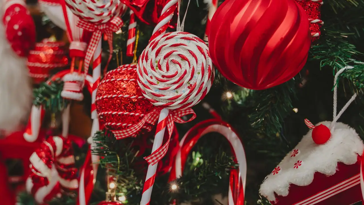 red ornaments and candy canes on a pine tree, image for jingle bells parody lines