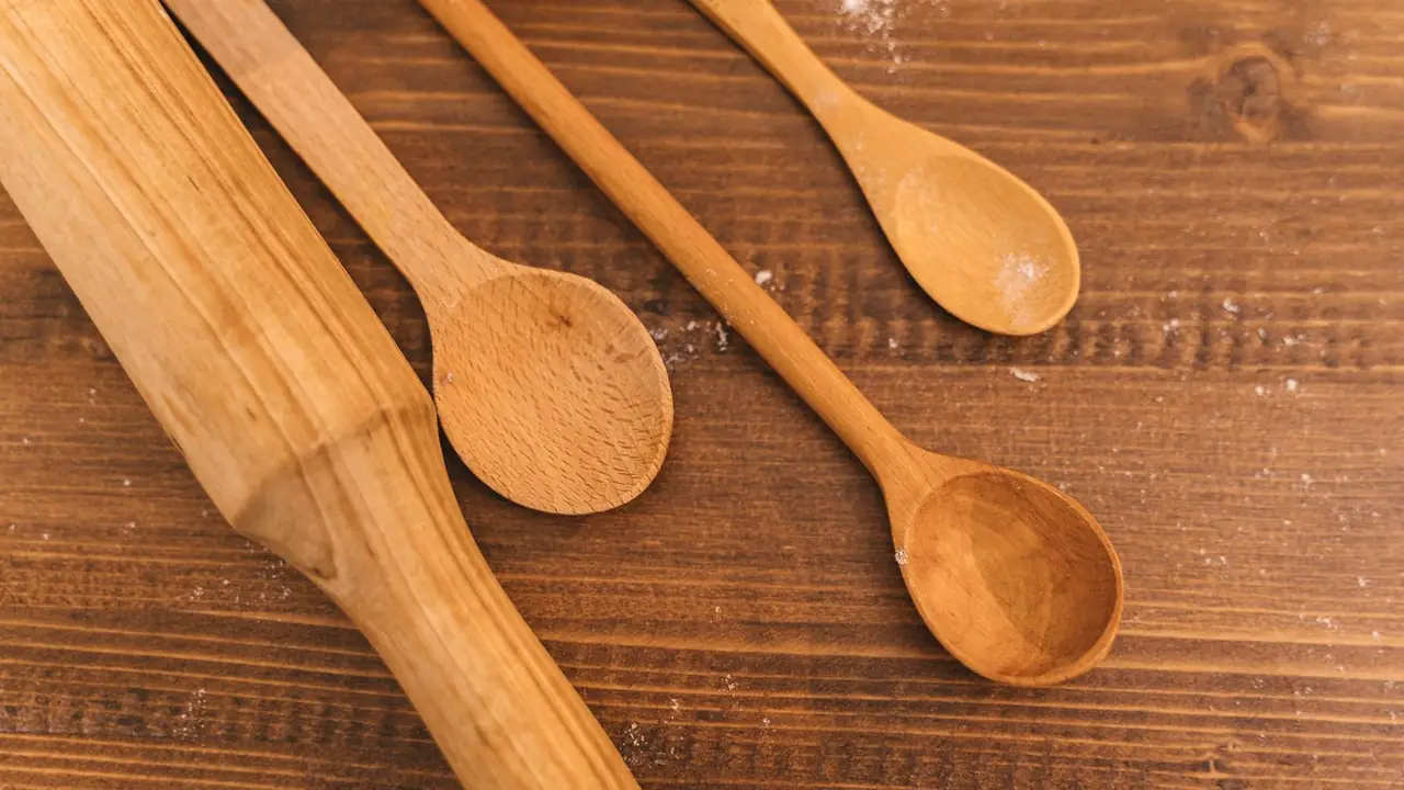 a set of wooden spoons lined up on a table, image for wooden spoon puns
