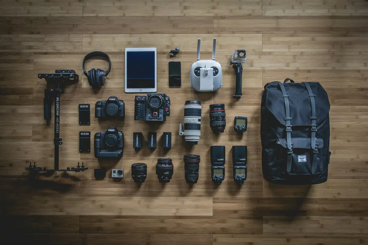 a black DSLR camera resting on a table with gear nearby, image for camera puns