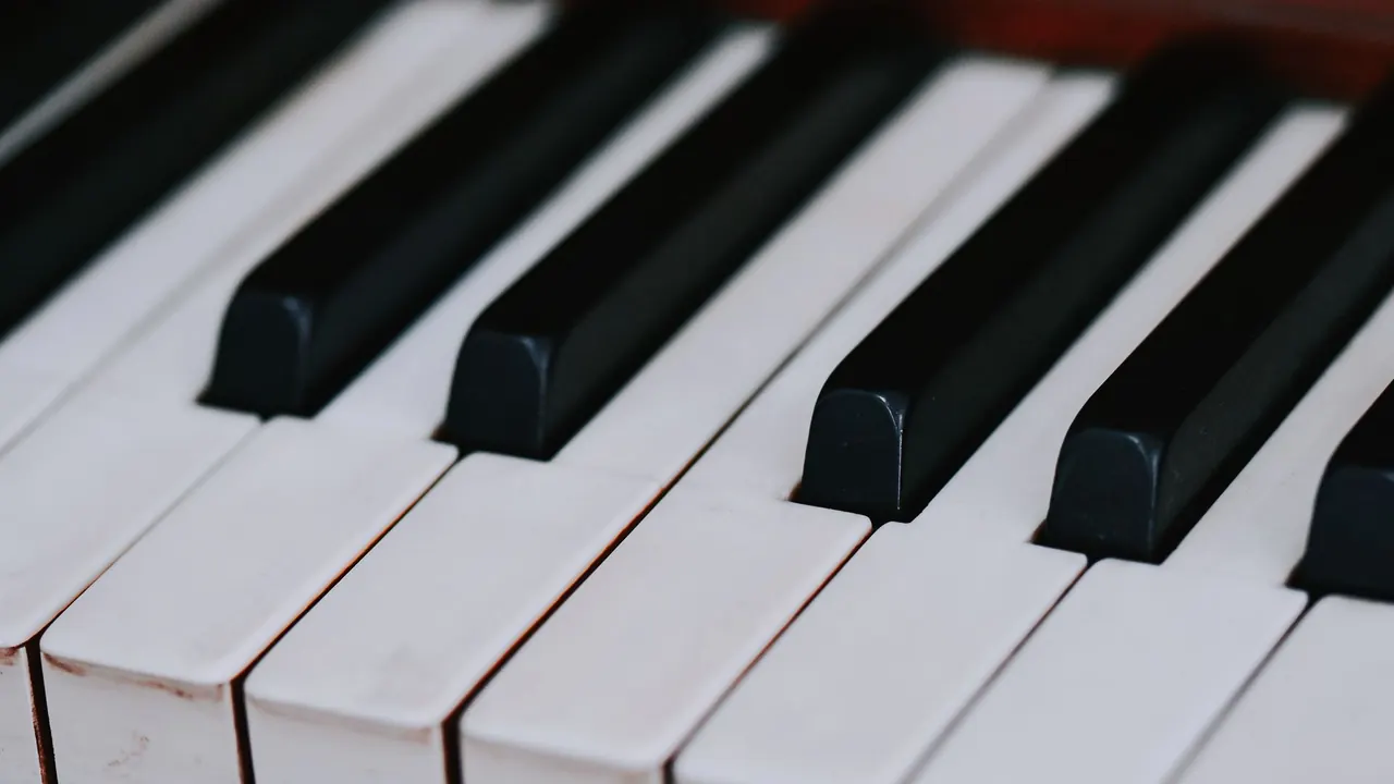a close-up of black and white piano keys, image for piano exam jokes