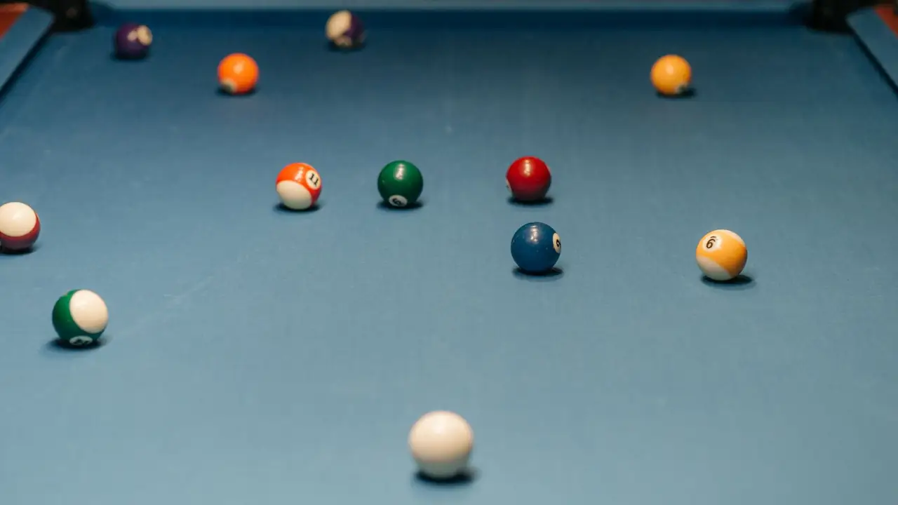 blue felt on a billiard table with balls near the pocket, image for pool table pocket puns