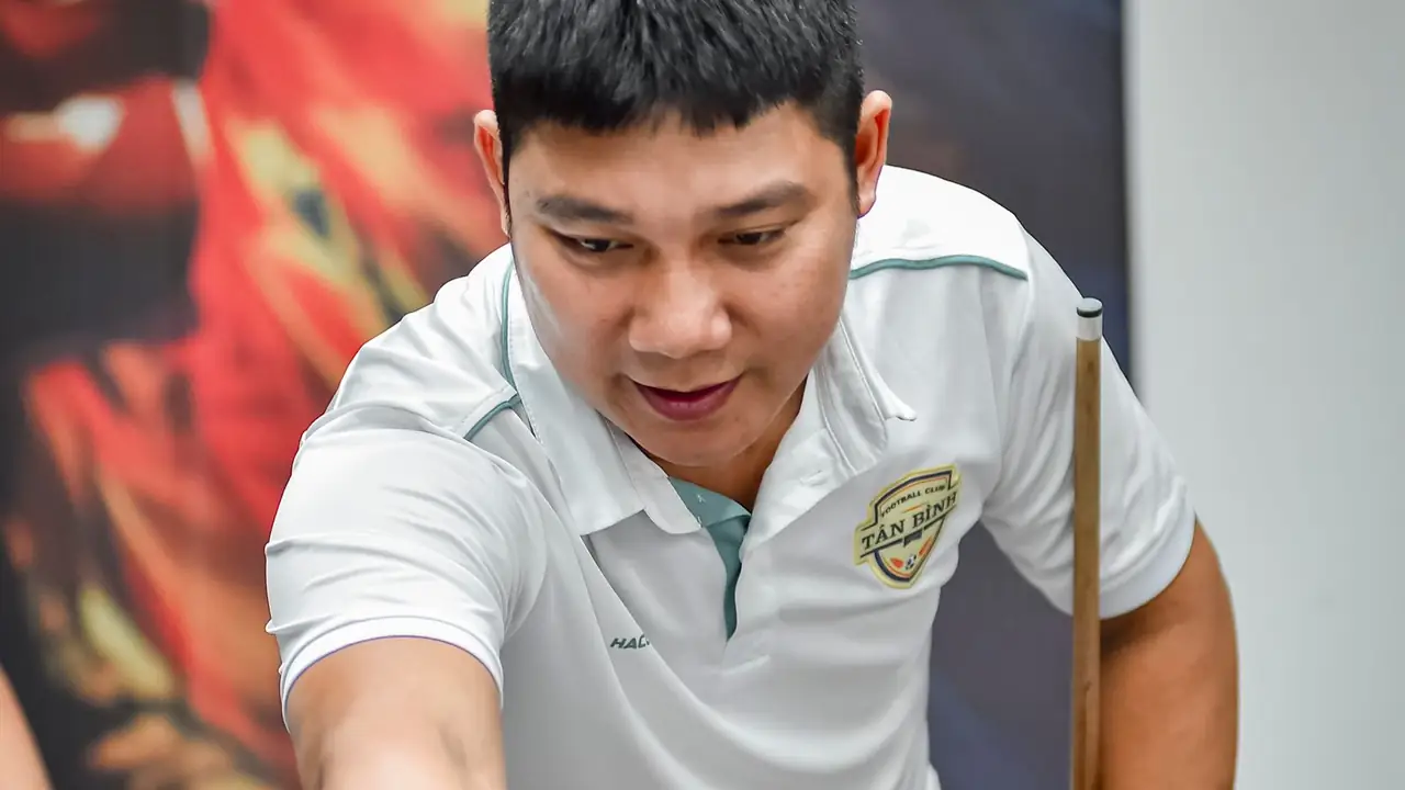 a player lining up a shot with a pool cue over a pool table, image for pool cue puns