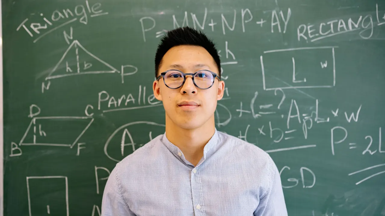 a smiling teacher standing in front of a chalkboard full of notes, image for spanish teacher jokes about conjugation